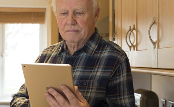Man looking at tablet